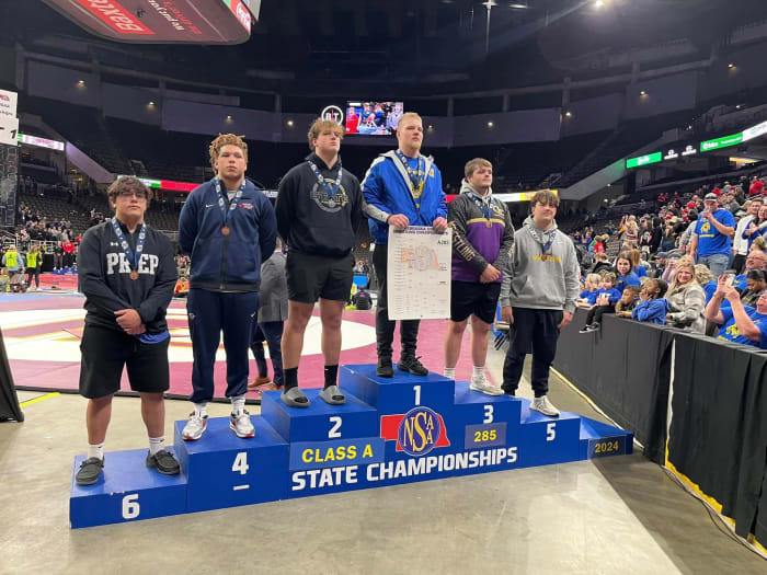 Omaha North's Tyson Terry stands atop the state podium last month after completing his third straight unbeaten championship season. Terry is one of more than 30 heavyweights on the SBLive list of the best in Nebraska. Photo by OmahaPubSchool on X.